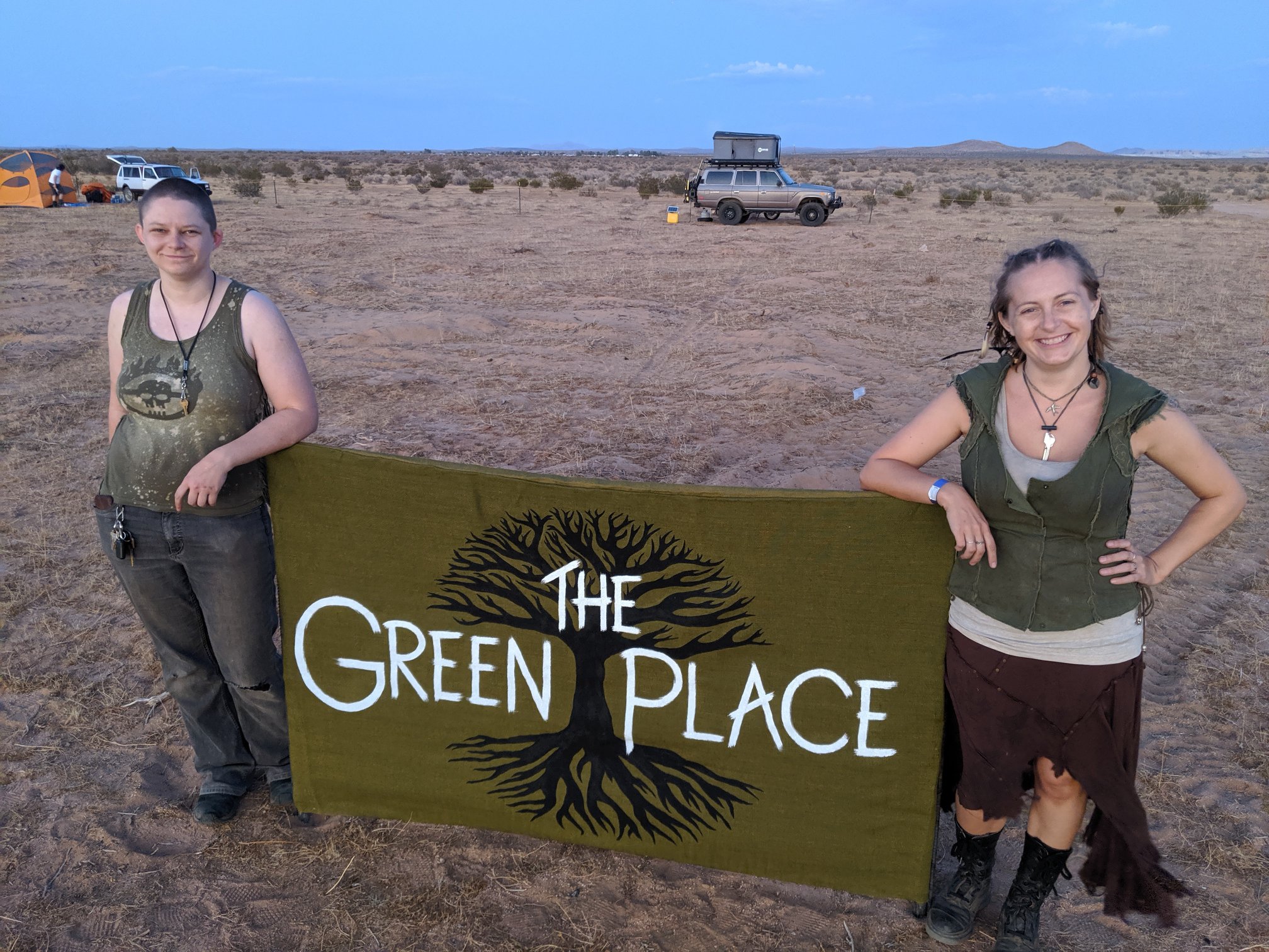 Donda and Sanguine posing beside the Green Place sign